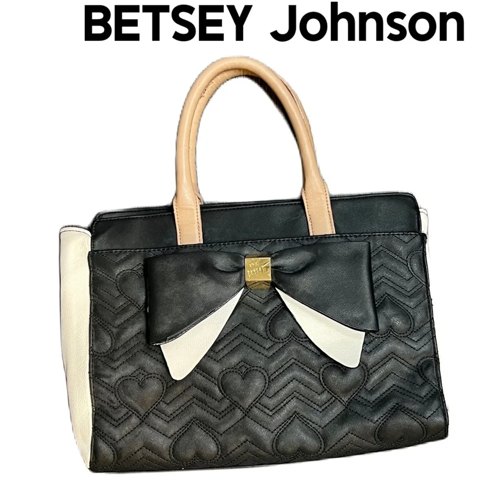 Betsey Johnson black and white quilted heart handbag with large bow.